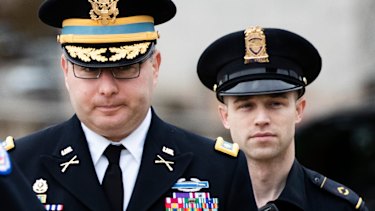 Army Lieutenant Colonel Alexander Vindman, a military officer at the National Security Council, left, arrives on Capitol Hill to testify.