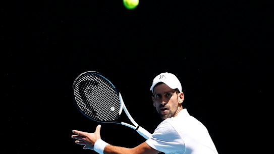 MELBOURNE, AUSTRALIA - JANUARY 12: Novak Djokovic of Serbia plays a forehand shot during a practice session ahead of the 2023 Australian Open at Melbourne Park on January 12, 2023 in Melbourne, Australia. (Photo by Darrian Traynor/Getty Images)