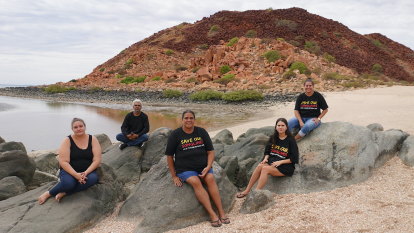 Pilbara rock art custodians want WA government, Woodside to hit pause on Burrup projects