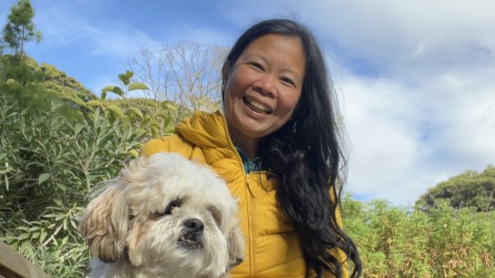 Maida Pineda with her dog Spark in the Royal Botanic Gardens.