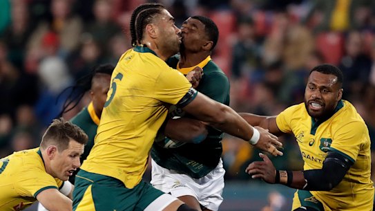 Defensive wall: South Africa's Warrick Gelant runs into Lukhan Salakaia-Loto at Ellis Park.