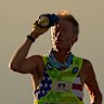 Westergaard, left, cools of with water with pacing help from daughter Madison Westergaard as the sun rises during the Badwater 135 Ultramarathon on July 8.