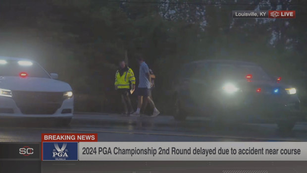 An image from the ESPN video shows Masters champion Scottie Scheffler being detained by police.
