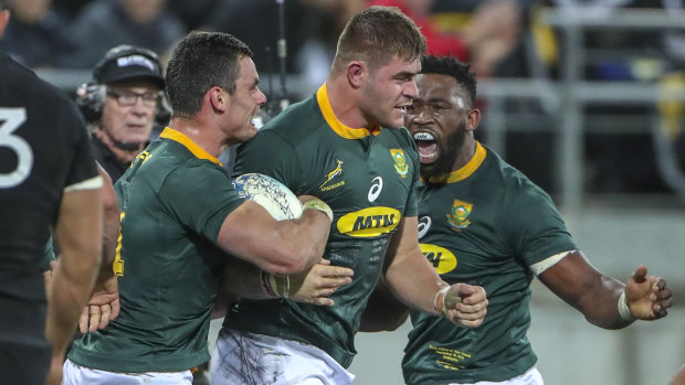 Rake's progress: Malcolm Marx is congratulated by Jesse Kriel and Siya Kolisi after scoring.