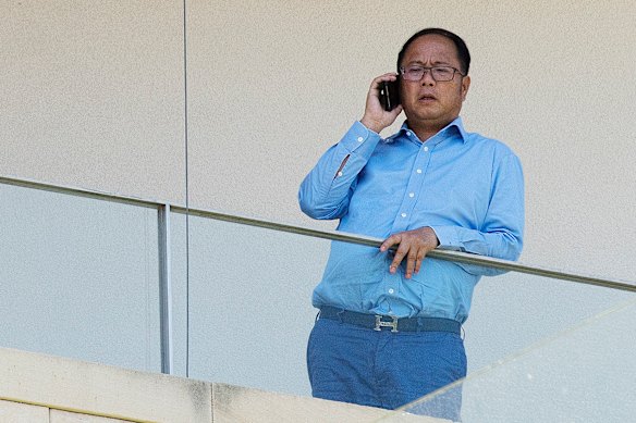 Chinese political donor Huang Xiangmo pictured on the balcony of his Mosman mansion before his Australian passport was cancelled.