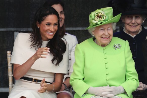 The Queen and Meghan attend the opening of the new Mersey Gateway Bridge in north-west England in 2018.