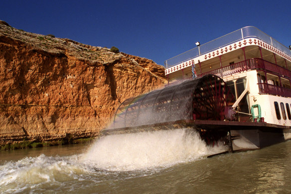 A paddlewheel boat passes beneath the Murray River gorges - an area once flooded by a 200km lake. 