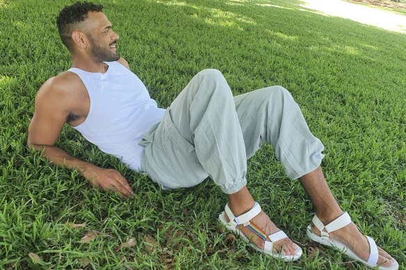 Actor, model and proud queer Mbabaram and Gureng man, Nathaniel Blackman, wears the Teva Pride sandals.