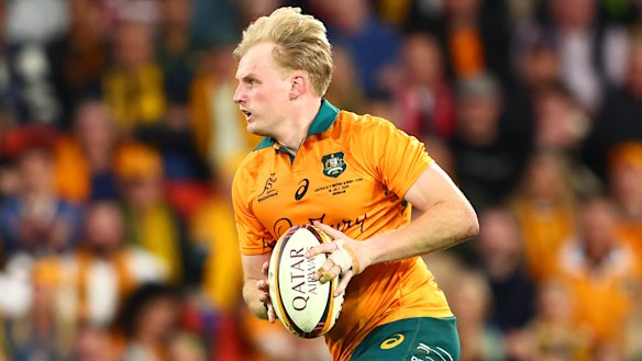 Tom Lynagh runs the ball back from a kick at Suncorp Stadium.