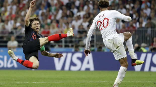 Croatia's Luka Modric, left, challenges England's Dele Alli.