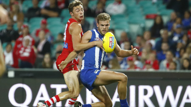 Falling short: Will Hayward of the Swans contests the ball against Ed Vickers-Willis of the Kangaroos.