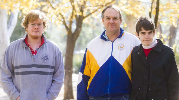 John Donovan (centre) and his two sons Nicholas (L) and Cameron (R) may struggle under potential changes to the NDIS.