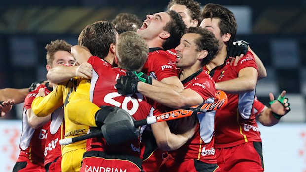 Belgian players celebrate their win over Netherlands in the gold medal game at the Men's Hockey World Cup at Kalinga Stadium in Bhubaneswar, India on Sunday.