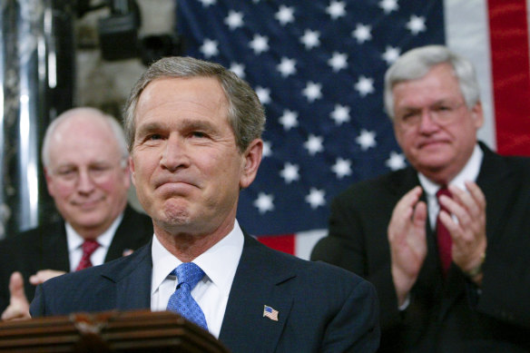 Dick Cheney (back left), then the vice president, applauds then-president George W. Bush during the 2003 State of the Union address.