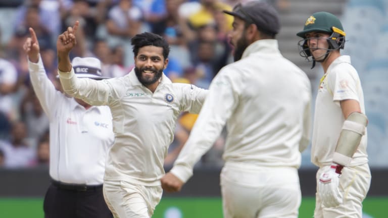 Momentum: Ravindra Jadeja dismisses Tim Paine as Australia lurched towards defeat at the MCG.
