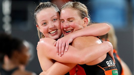 Giants Sophie Dwyer and April Brandley embrace at fulltime.