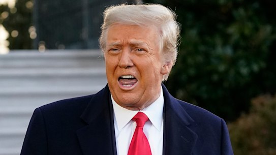 President Donald Trump speaks with reporters as he walks to board Marine One on the South Lawn of the White House, Wednesday, Jan. 20, 2021, in Washington. Trump is en route to his Mar-a-Lago Florida Resort. (AP Photo/Alex Brandon)