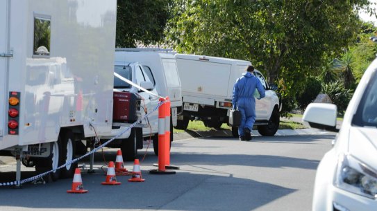 Police at the Ulinga Street crime scene in Parkinson on the afternoon of December 18, 2020. Detectives have uncovered a link between the man shot dead on the Logan Motorway, 22-year-old Raghe Abdi, and the couple killed in their Parkinson home - Maurice Antill, 87, and Zoe Antill, 86. Photos: Matt Dennien
