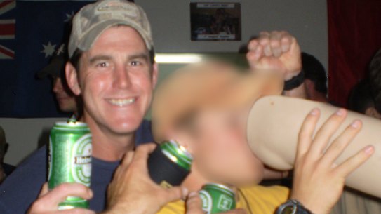 SAS soldier Ben Roberts-Smith with the prosthetic leg taken from an Afghan man whom he killed.