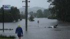 A car stranded in floodwaters in Buladelah on Sunday.