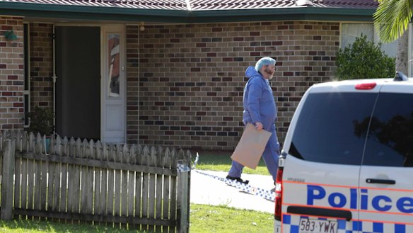 Police outside the Antills’ home in Parkinson after their bodies were found.