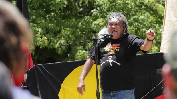 Wayne Wharton addresses the crowd at the Invasion Day rally in Brisbane.