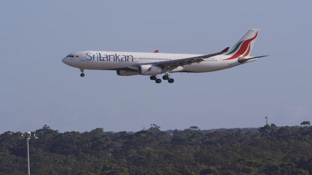 A SriLankan Airlines flight carrying the first international passengers arrives at Melbourne Airport as Victoria’s hotel quarantine system resumes today. 

