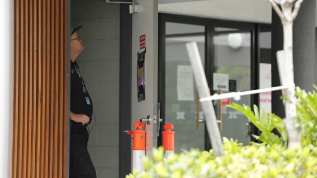 Police monitor entrances to the Hotel Grand Chancellor in Brisbane.