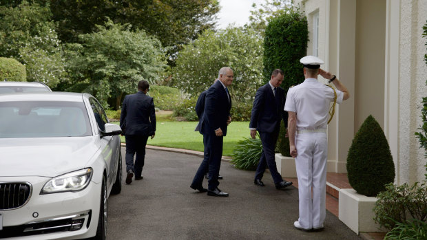 Prime Minister Scott Morrison arriving at Government House on Sunday morning.