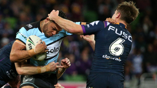 Jesse Ramien is tackled by Storm's Cameron Munster.
