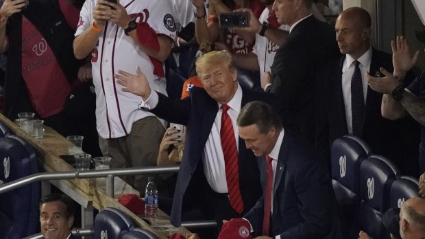 President Donald Trump is introduced during the third innings of Game 5 of the baseball World Series in Washington. 