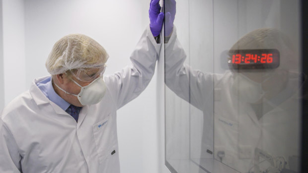 Britain’s Prime Minister Boris Johnson visits a laboratory in Livingston, Scotland.