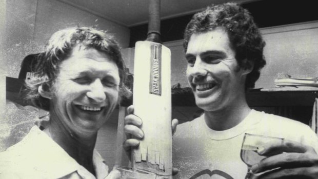 Sam Trimble and Greg Chappell with celebration beers at the Brisbane Cricket Ground in 1975.  