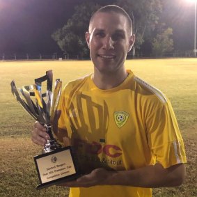 Mr Jones with the 2019 pre-season cup his team won.