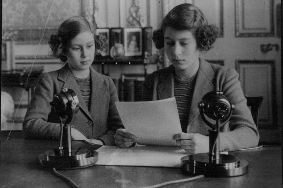 Princess Elizabeth with her script for her first radio broadcast, aged 14, on October 13, 1940. On the left is her younger sister, Princess Margaret.