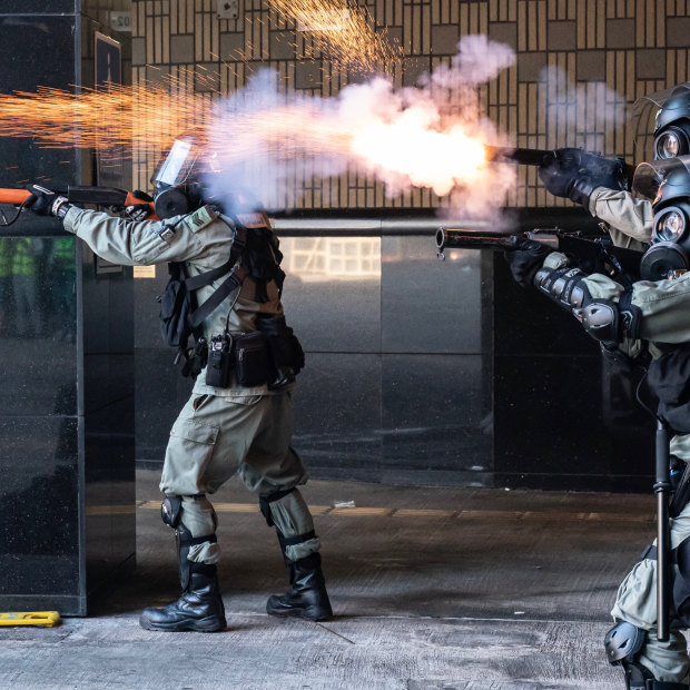 Riot police fire tear gas and rubber bullets as protesters attempt to leave the Hong Kong Poytechnic University on November 18.