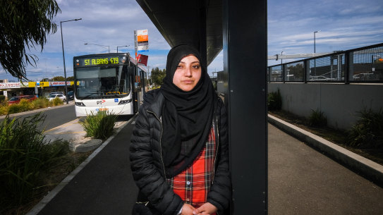 Public transport commuter Syed Zahra at the bus stop outside the St Albans train station where she commutes to for work. She spends $24 on Uber to get from a housing estate to Rockbank train station to get to work because there are no buses. Photo Luis Ascui