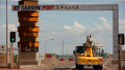 Chinese officials blame the uncertainty over a review of Darwin Port for contributing to reluctance by some companies to invest in Australia. 