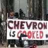 Grandparents superglue themselves to Chevron HQ in Perth protest