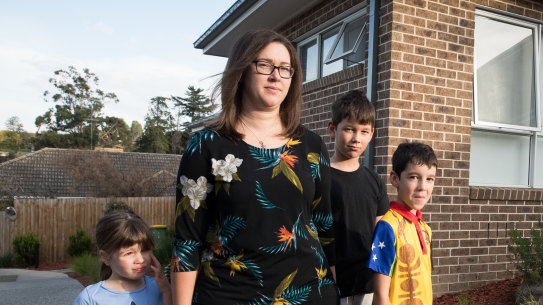 Katie George with her children outside her home on Borlase Street last year.
