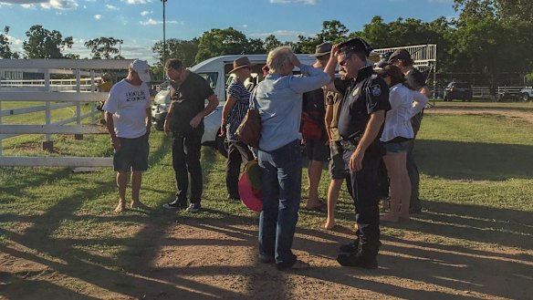 Police speaking to witnesses and convoy members after the incident.