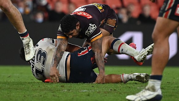 Victor Radley collects the legs of Albert Kelly after a field goal attempt. 