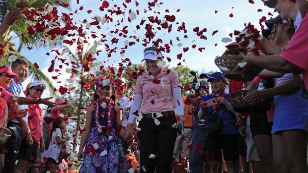 Brooke Henderson is showered with flower petals after her win.