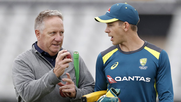 Word of advice: Former Australian wicketkeeper Ian Healy talks tactics with Tim Paine at Old Trafford.