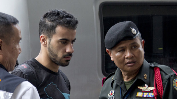 Bahraini football player Hakeem al-Araibi, centre, is brought in to a court in Bangkok, Thailand, on Tuesday. 