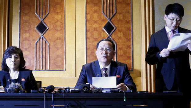 Ri Yong-Ho, North Korea's Foreign Minister, centre, speaks as Choe Son Hui, North Korea's Vice Foreign Minister, left, listens during a during a news conference following the Hanoi Summit.