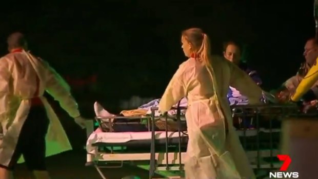 A Victorian man is wheeled into Mackay Base Hospital on Monday night.