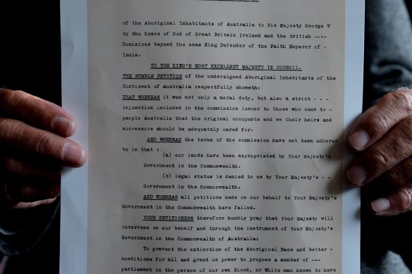 Uncle Boydie Turner with a copy of the petition originally written by his grandfather William Cooper for Aboriginal representation in parliament.
