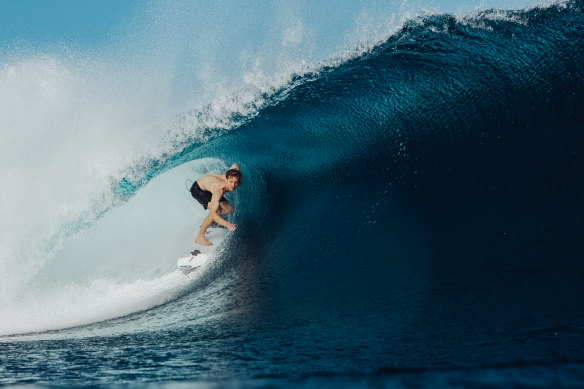 On cloud nine: Connellan at Fiji’s iconic Cloudbreak a few years into his recovery.
