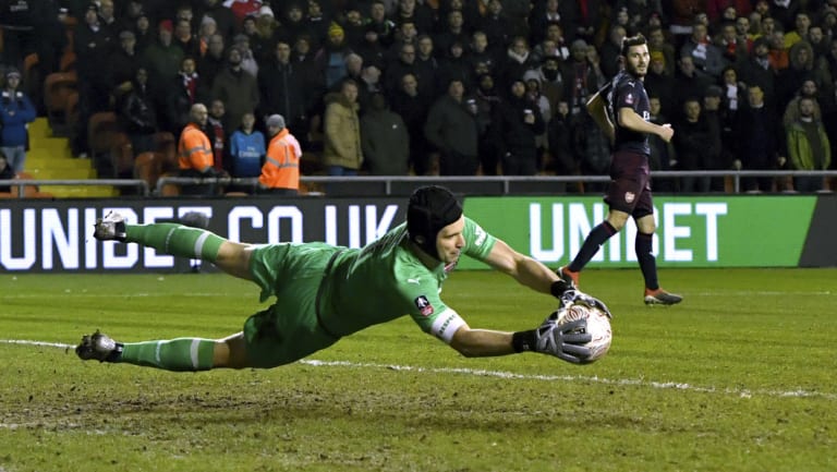 Petr Cech makes a save for Arsenal.